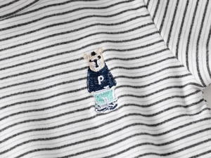 Close-up of classic striped kids' shirt featuring a detailed bear embroidery with letter P