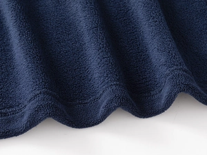 Detail of dark blue fleece fabric with reinforced double stitching on the hemline