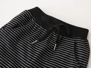 Detail view of boys striped joggers featuring elastic ribbed waistband with adjustable drawstring