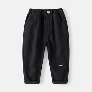 Classic black casual boys' trousers with elastic waist and fashion label detail