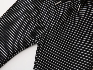 Close-up of black and white striped toddler joggers with adjustable drawstring waistband