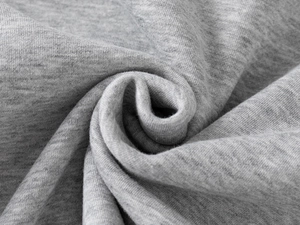 Macro shot of heather grey cotton knit fabric texture for boys fleece baseball jacket