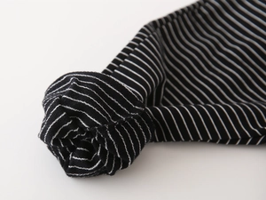 Detailed close-up showing the elasticated black and white striped cuff of boys joggers.