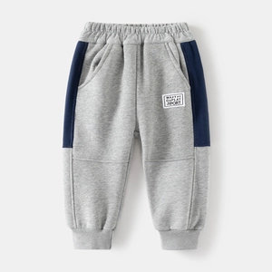 Thickened boys sports pants in grey with navy side stripes and elastic cuffs