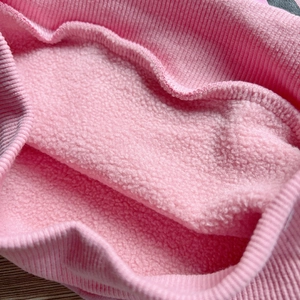 Pink fleece-lined kids sweatshirt with ribbed cuffs for warmth and soft comfort