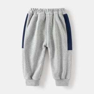 Detailed view of gray and navy thick fleece boys' joggers with ribbed elastic cuffs