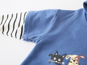 Detail of kids hoodie showing navy blue fabric with black and white striped layered sleeves