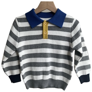 Children's striped polo sweater with blue collar and long sleeves on a wooden hanger
