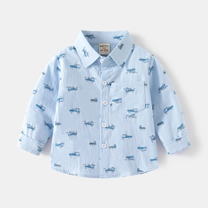 Light blue boys long sleeve shirt with cartoon construction vehicle print and chest pocket