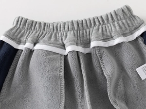 Close-up of boys thick sports pants showing elastic waistband and warm fleece lining