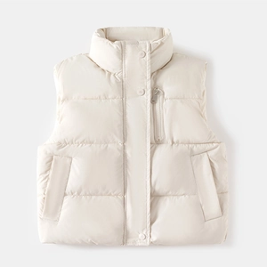 Detail of beige quilted vest featuring standing collar zipper and snap button closure
