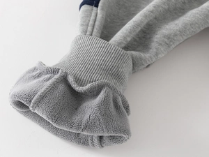 Detail of boys thermal pants showing thick fleece lining and ribbed windproof cuffs