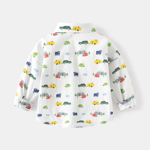 Detail of kids long sleeve shirt featuring colorful camping prints and cotton texture