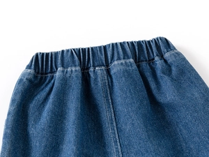 Detailed view of kids' blue denim shorts with elastic waistband and high-quality stitching