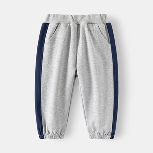 Detail of children's grey joggers with blue side stripes and elasticated waistband