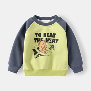 Close-up of raglan sleeves and rib-knit cuffs on a yellow toddler bear printed sweatshirt