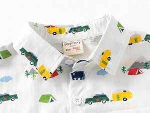 Close-up of boys' white camping print shirt showing collar detail and neat stitching