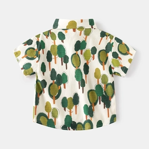 Detailed back view of boy's short sleeve shirt with all-over forest tree print