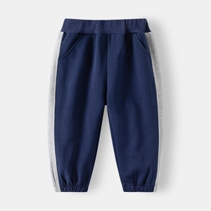 Detail of kids' blue and gray color-block sweatpants with elastic waist and ribbed cuffs
