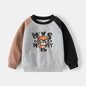 Detail of kids grey sweatshirt featuring raglan sleeves and cartoon bear print