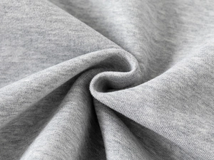 Close-up of premium heather grey fleece fabric showing soft knitted texture and thick fibers
