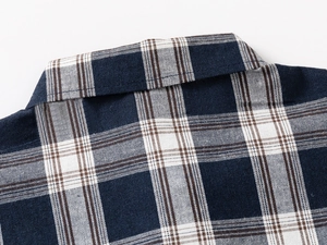 Detailed view of the plaid shirt collar showing navy blue check pattern and neat stitching