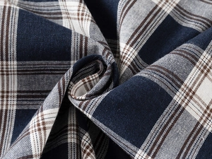 Macro shot of blue and brown checkered fabric with detailed cotton weave texture