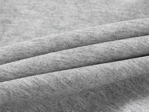 Detailed close-up of grey marl knitted fabric texture on kids sports sweatshirt set