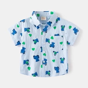 Detail of light blue short sleeve boy shirt with navy bear and green heart prints