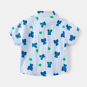 Detail view of the breathable cotton fabric with bear and heart patterns on the shirt back