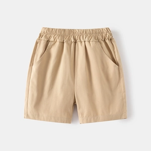 Detail of khaki cotton kids shorts with elastic waistband and functional side pockets