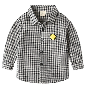 Classic black and white checkered long sleeve shirt for boys with yellow smiley patch