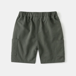 Detail view of deep olive green cotton cargo shorts with elastic waist and side pockets