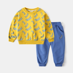 Detail of yellow sweatshirt and blue sweatpants with cute sea otter prints for kids
