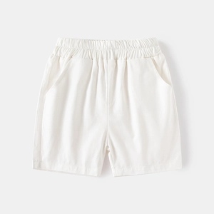 Detail of boys' off-white cotton shorts featuring an elastic waistband and side pockets