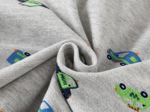 Macro detail of soft light gray cotton fabric with colorful cartoon car prints