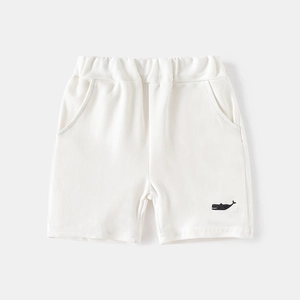 Detailed view of kids white cotton shorts with elastic waistband and whale embroidery