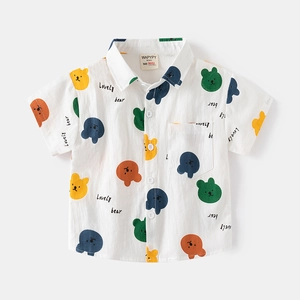 Detailed view of kids short sleeve shirt with bear print and branded size label