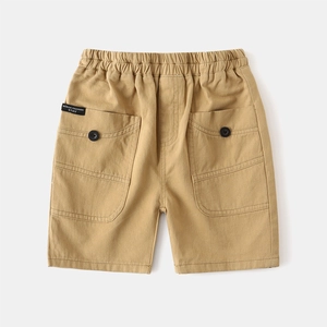 Detail of kids khaki cargo shorts featuring elastic waistband and fashion text label