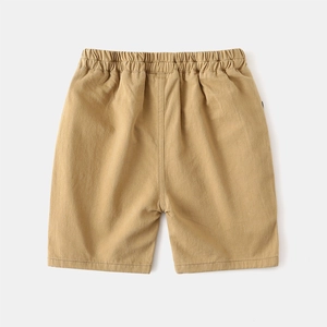 Close-up of elastic waistband and khaki cotton twill texture on kids casual shorts