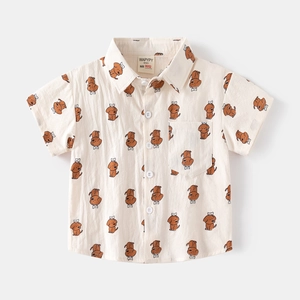 Detail of boys short-sleeved cotton shirt with cartoon puppy print and branded collar label