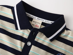 Detail of boys' striped polo shirt neckline showing high-quality collar and brand inner label