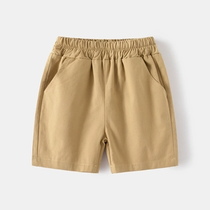 Detailed view of khaki woven shorts with elastic waistband and side pockets for boys