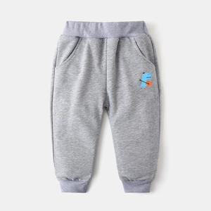 Detail of grey toddler sweatpants with elastic waist and cute dinosaur playing guitar print
