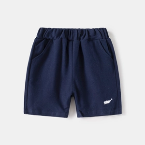 Detail of kids dark blue cotton shorts with elastic waist and whale embroidery
