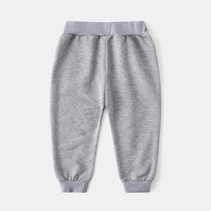 Rear view of light gray cotton kids joggers featuring elastic waist and ribbed ankle cuffs