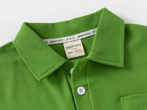 Detail of lime green polo shirt collar with breathable pique texture and white buttons