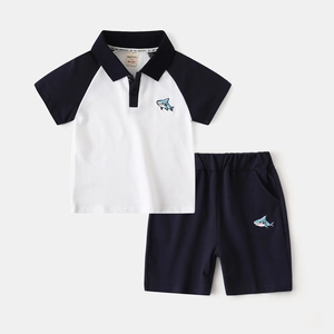 Boys summer polo shirt and shorts set featuring color-block design and shark embroidery