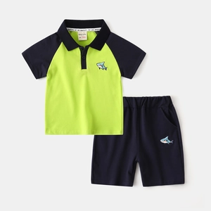 Boys summer two-piece polo set with neon green contrast sleeves and shark embroidery
