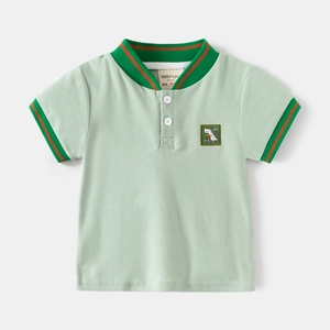 Kids mint green cotton polo shirt with dinosaur embroidery and striped collar detail